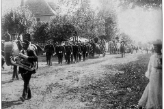 Bernardsville Parade with local firefighters - circa 1905 - Local fireman march down Olcott Avenue in front of the Olcott School in Bernardsville.